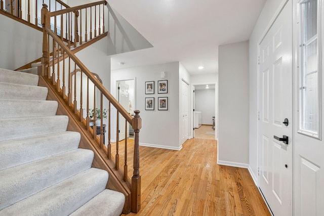 foyer with light hardwood / wood-style floors