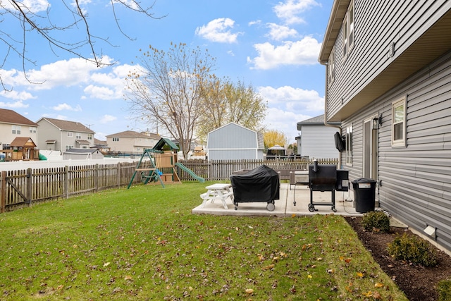 view of yard with a playground and a patio area