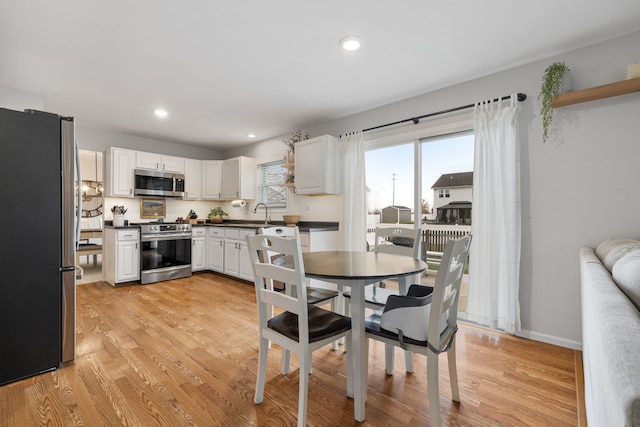 dining room featuring light wood-type flooring