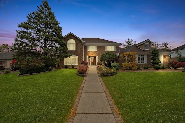 view of front of home featuring a lawn