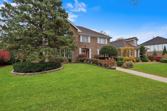 colonial home with a front yard