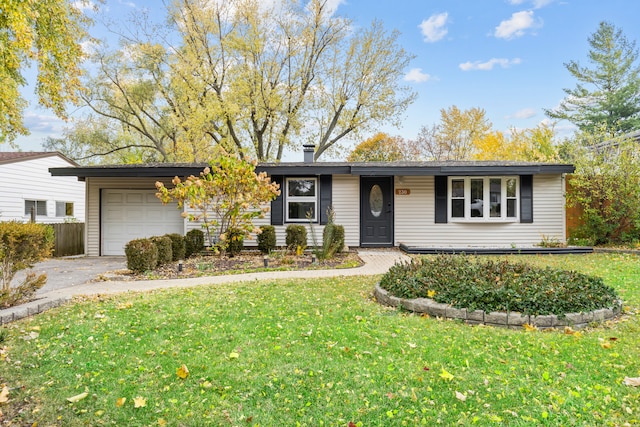 ranch-style home with a front yard and a garage