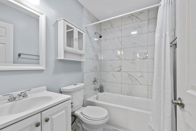 full bathroom with vanity, shower / bath combination with curtain, and toilet