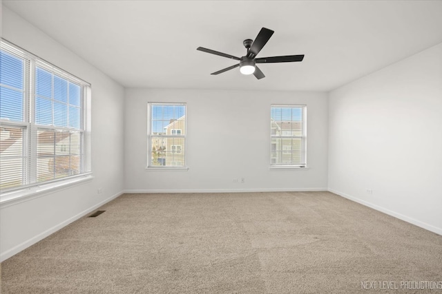 unfurnished room with light carpet and ceiling fan