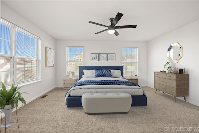 bedroom with light colored carpet and ceiling fan