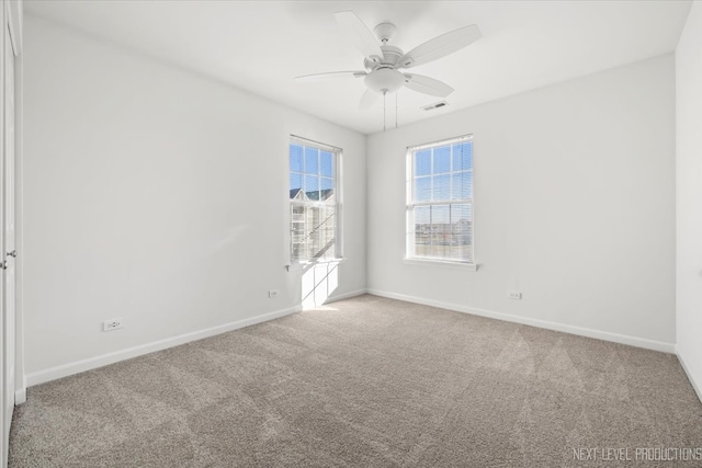 unfurnished room featuring carpet and ceiling fan