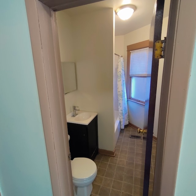 full bathroom with vanity, toilet, and shower / bath combo with shower curtain