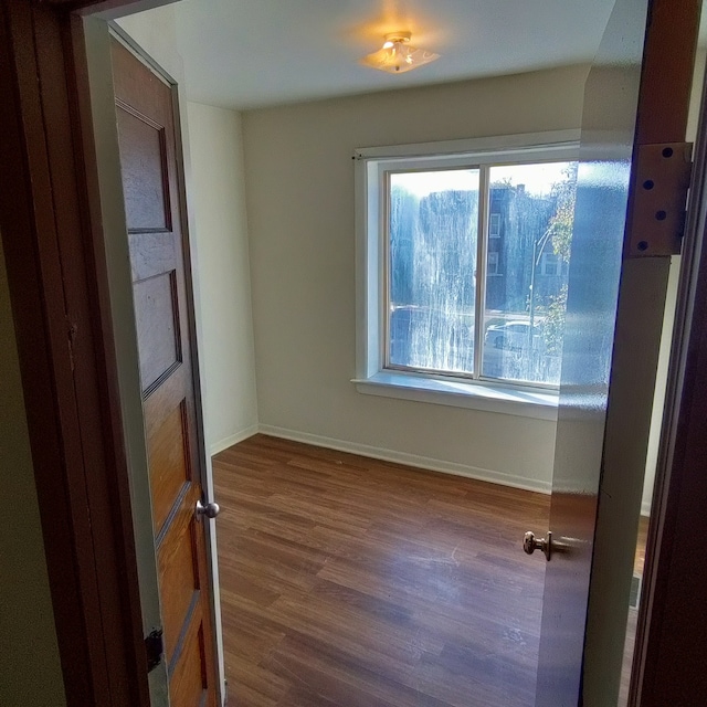 unfurnished room featuring hardwood / wood-style floors