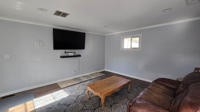 living room featuring crown molding and dark hardwood / wood-style floors