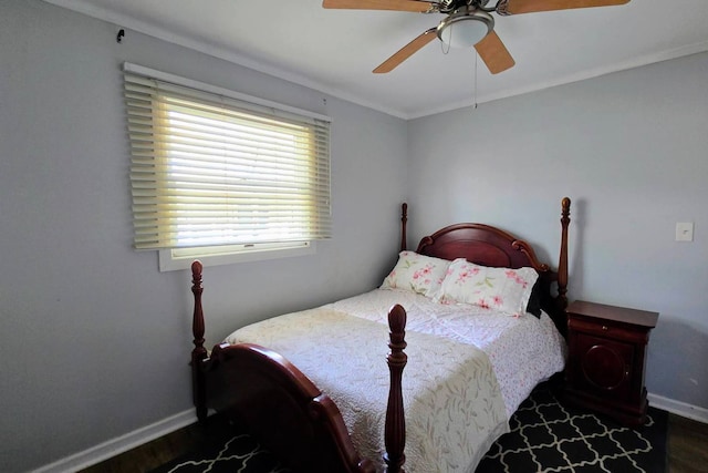 bedroom with ornamental molding, dark wood-type flooring, and ceiling fan