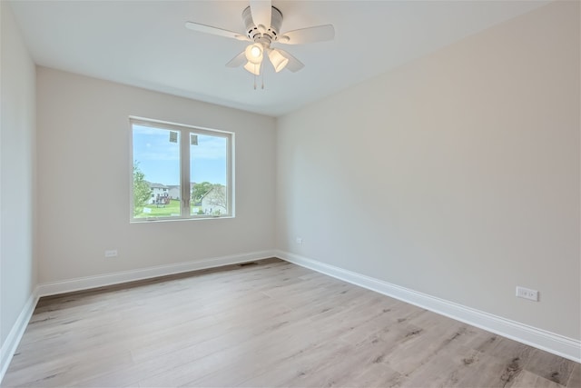 empty room featuring light hardwood / wood-style flooring and ceiling fan