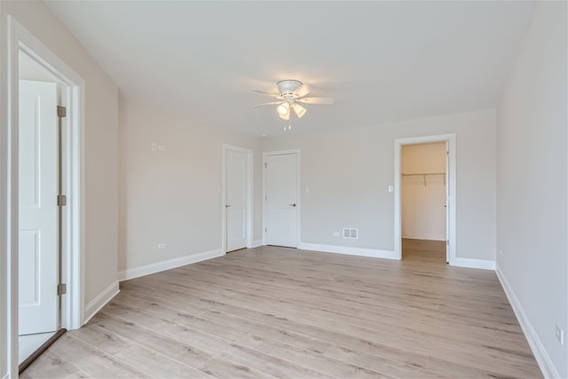 unfurnished room with light hardwood / wood-style floors and ceiling fan