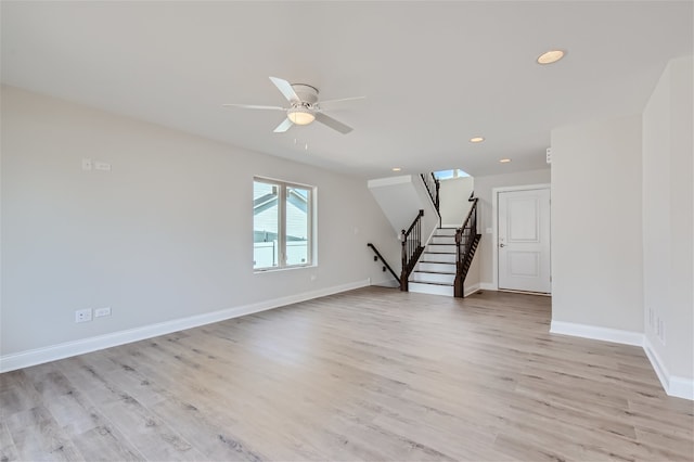 interior space with light wood-type flooring and ceiling fan