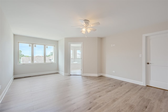 unfurnished room featuring light hardwood / wood-style flooring and ceiling fan