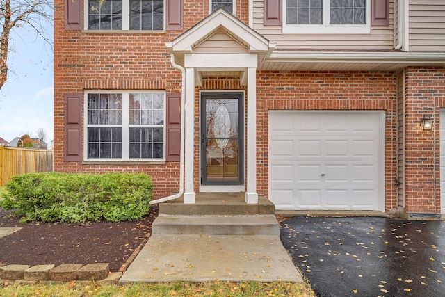 view of exterior entry featuring a garage