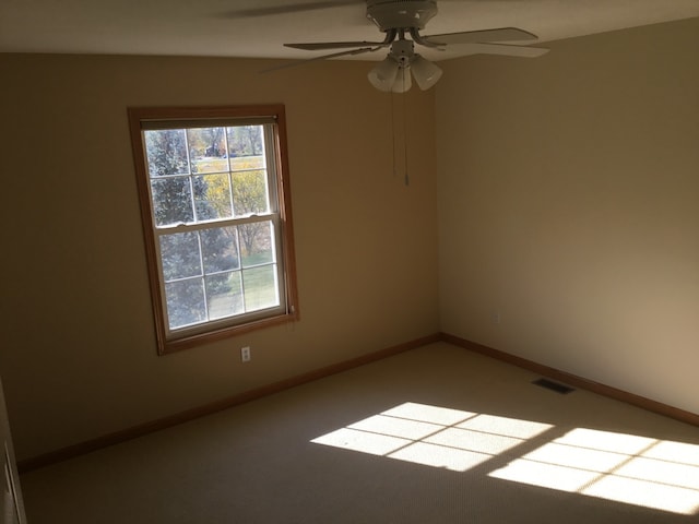 unfurnished room with ceiling fan