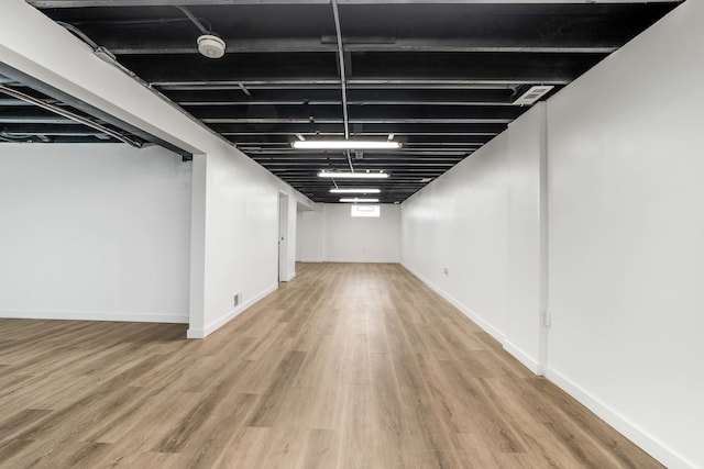 basement featuring hardwood / wood-style floors