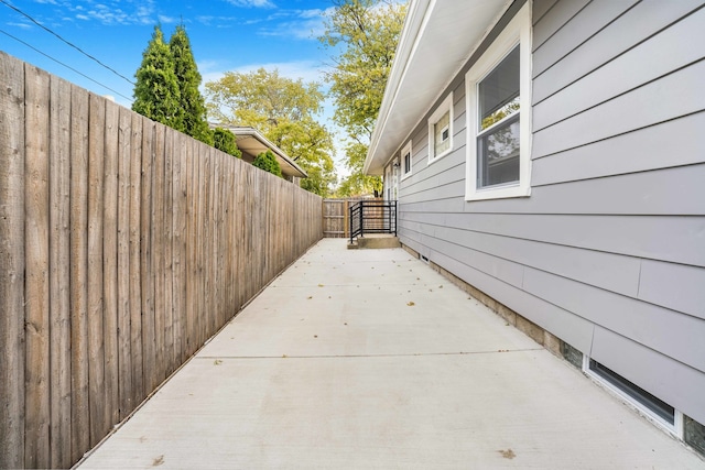 view of side of property with a patio area