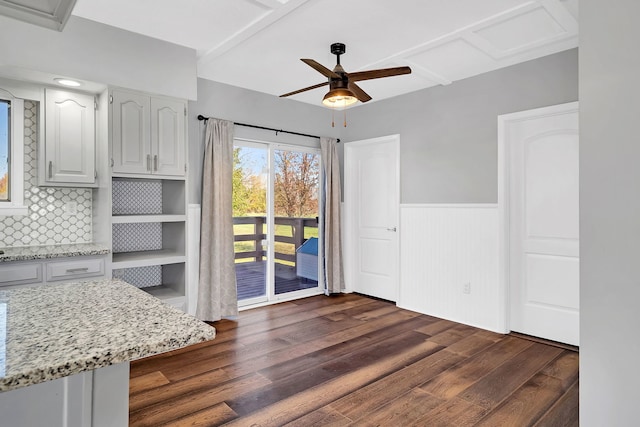 interior space featuring ceiling fan and dark hardwood / wood-style floors