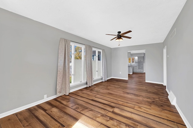 interior space featuring ceiling fan and dark hardwood / wood-style flooring