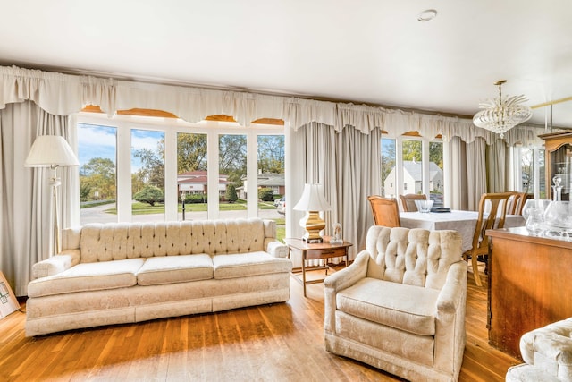 sunroom with a chandelier and plenty of natural light