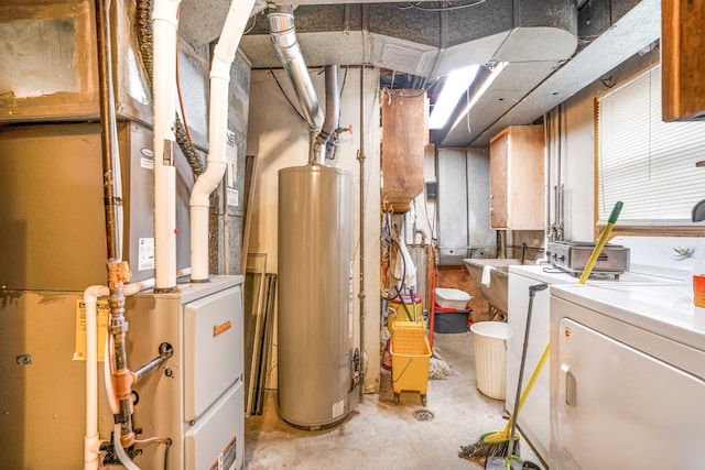 utilities featuring sink, heating unit, washing machine and dryer, and gas water heater