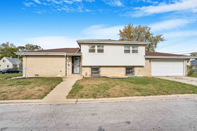 split level home featuring a front lawn and a garage