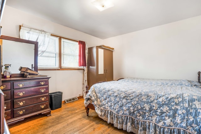 bedroom with light hardwood / wood-style flooring