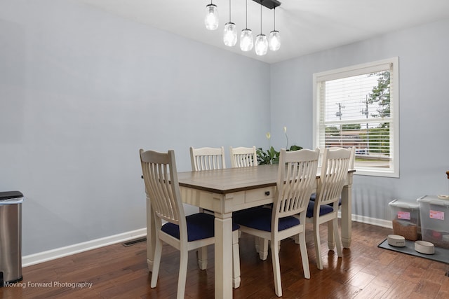 dining space featuring dark hardwood / wood-style flooring