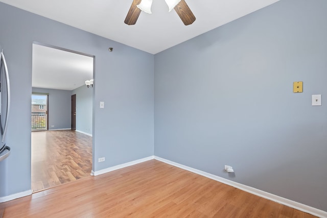 empty room featuring light hardwood / wood-style flooring and ceiling fan