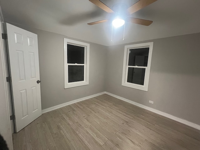 unfurnished room with light hardwood / wood-style floors and ceiling fan