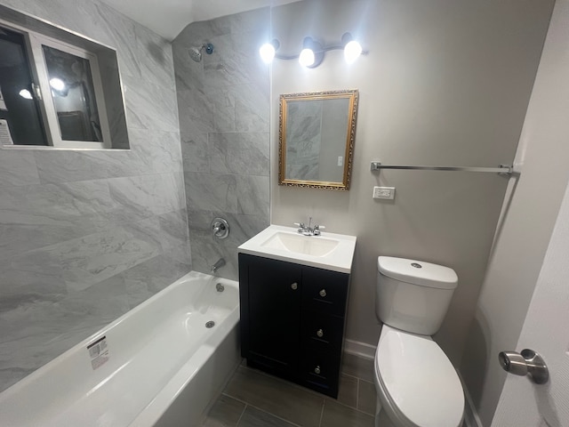 full bathroom featuring vanity, toilet, and tiled shower / bath combo