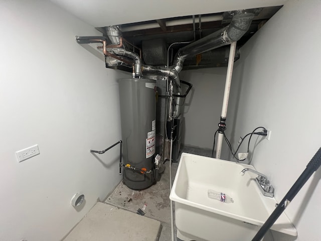 utility room featuring gas water heater