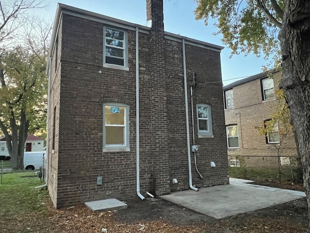 back of house with a patio