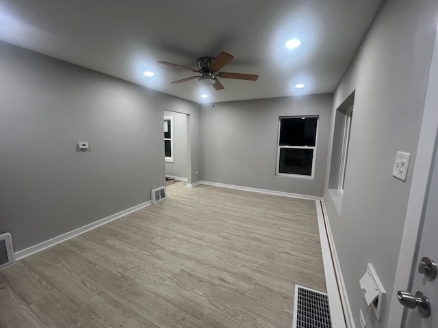 unfurnished room featuring light hardwood / wood-style floors and ceiling fan