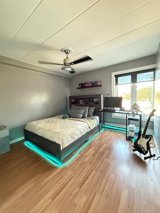 bedroom featuring hardwood / wood-style floors and ceiling fan