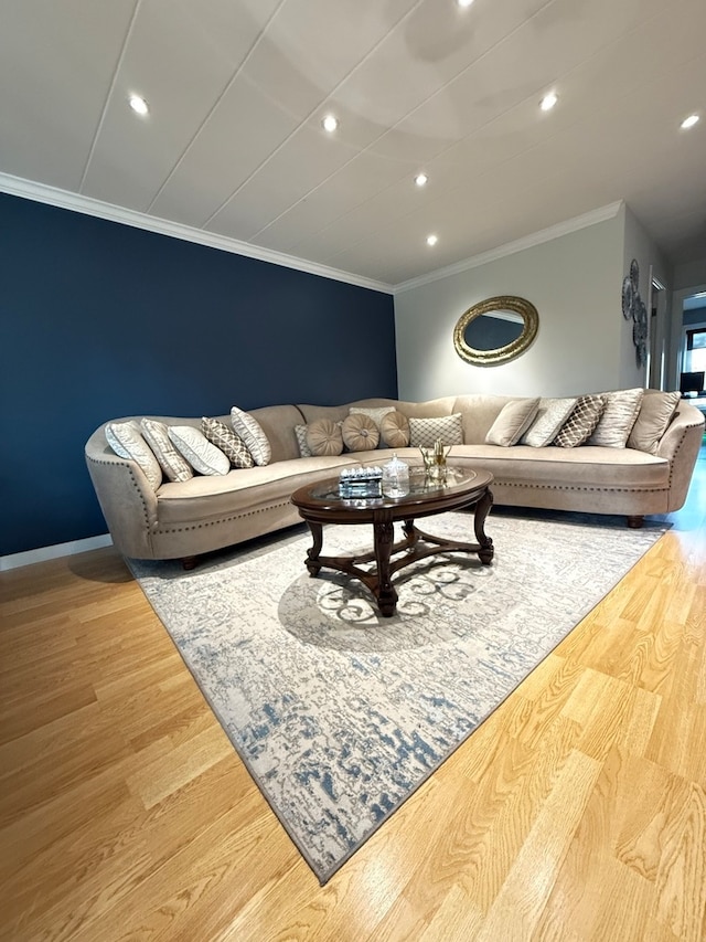 living room with ornamental molding and hardwood / wood-style flooring