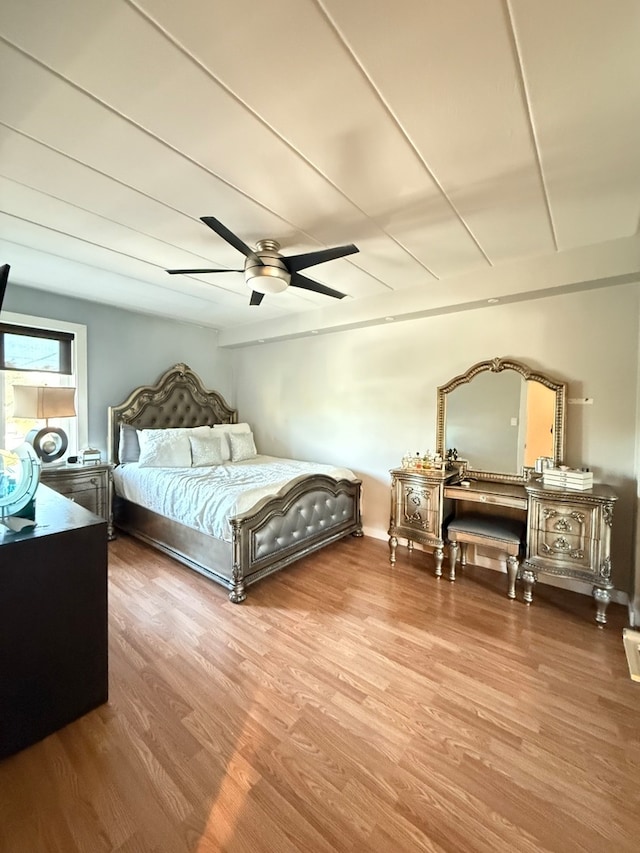 bedroom featuring wood-type flooring and ceiling fan