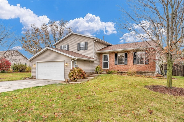 tri-level home with a garage and a front yard