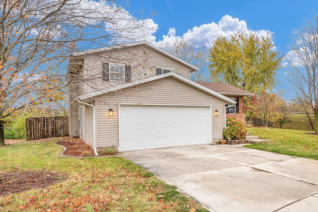 view of side of property with a garage and a yard