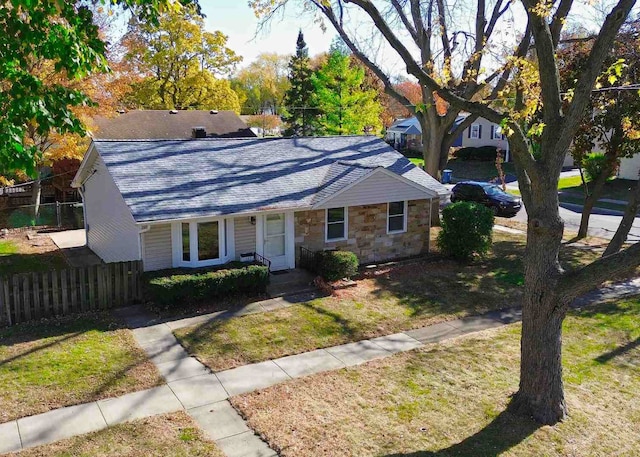 ranch-style house featuring a front yard