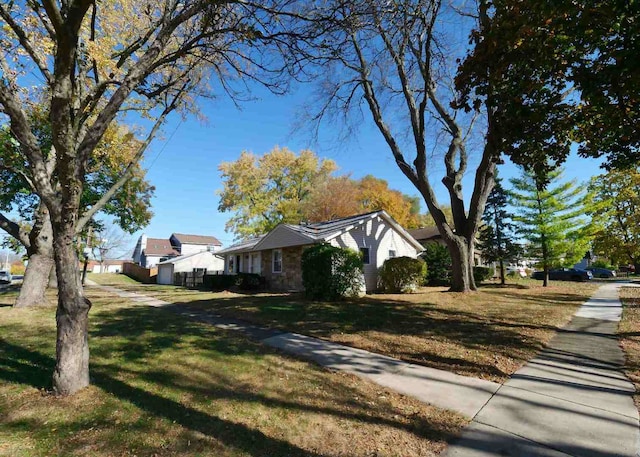 view of home's exterior with a lawn