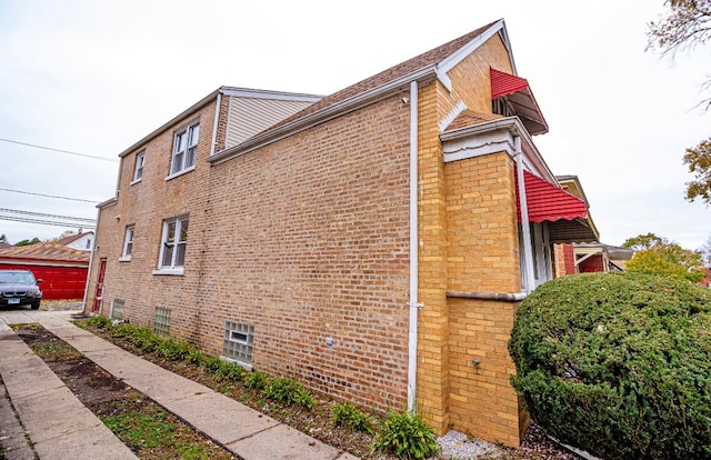 view of side of property featuring a garage