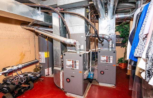 utility room featuring gas water heater