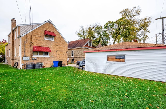 rear view of house with a lawn