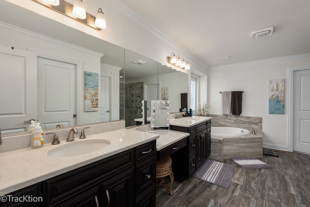 bathroom with separate shower and tub, wood-type flooring, crown molding, and vanity