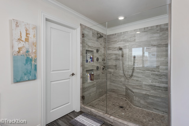 bathroom with walk in shower, wood-type flooring, and ornamental molding