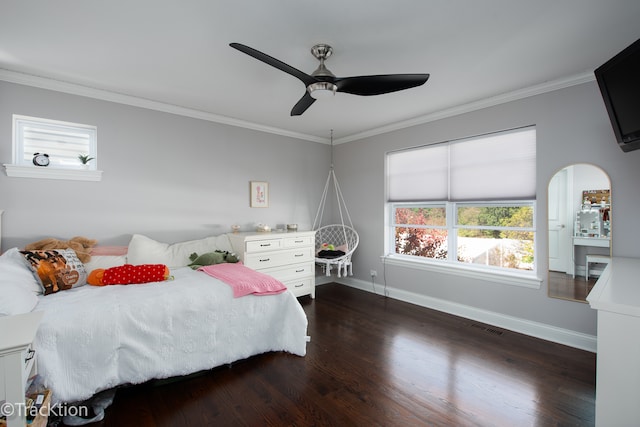 bedroom featuring ceiling fan, dark hardwood / wood-style floors, and ornamental molding