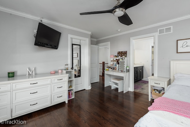 bedroom with crown molding, dark hardwood / wood-style flooring, ceiling fan, and ensuite bath