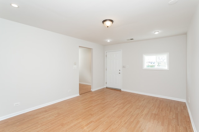 unfurnished room featuring light hardwood / wood-style floors